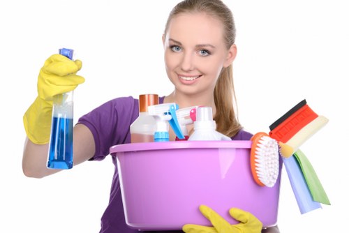 Cleaning technician using extraction equipment on a carpeted floor